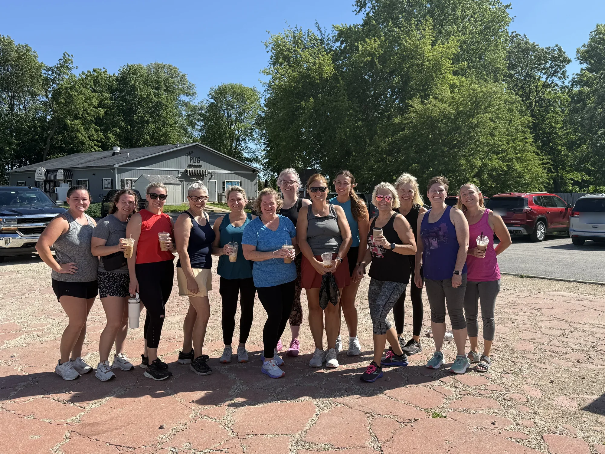Get Pumped Up community members gathered outdoors after boot camp